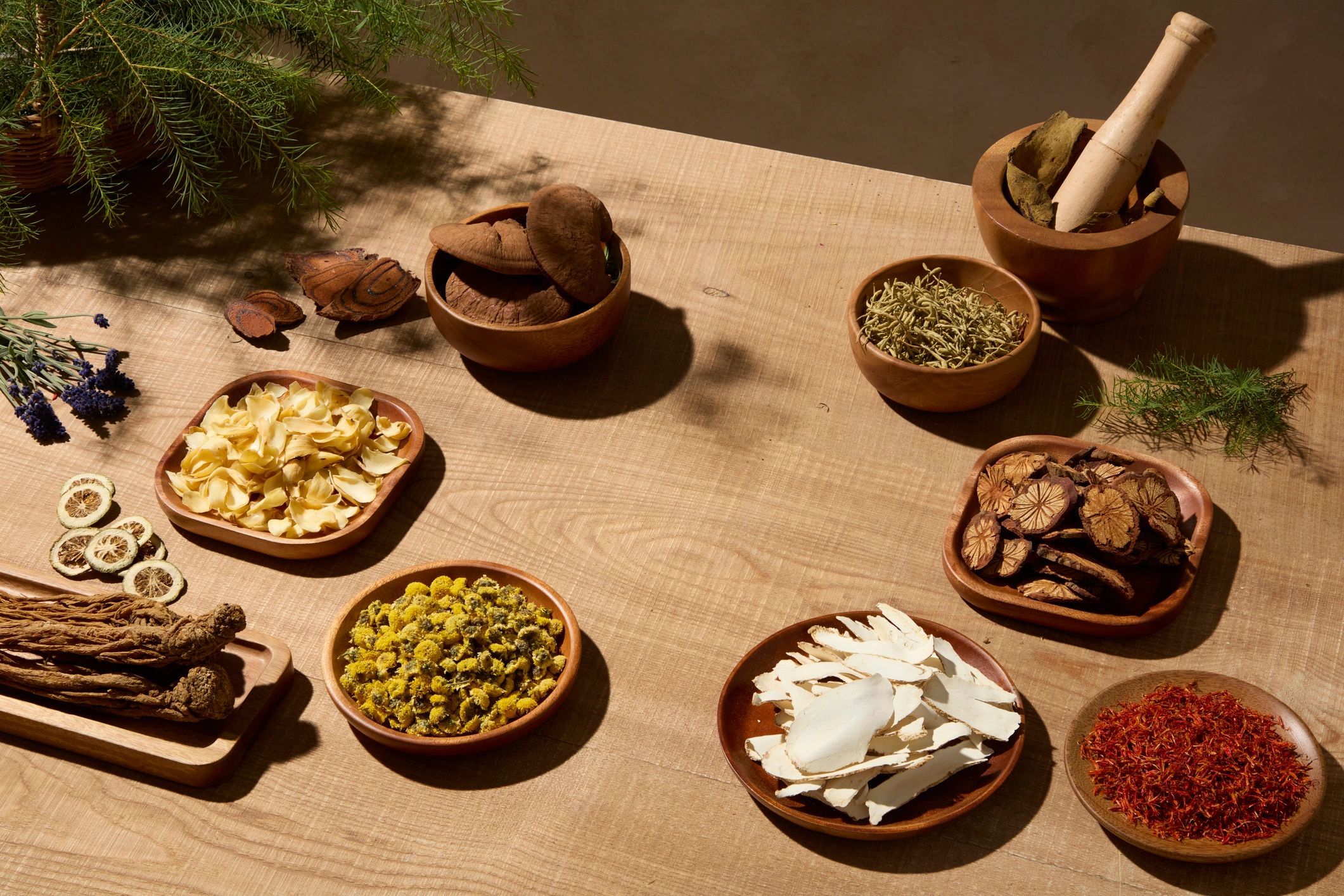 Natural beverage ingredients arranged on a work surface for drink development